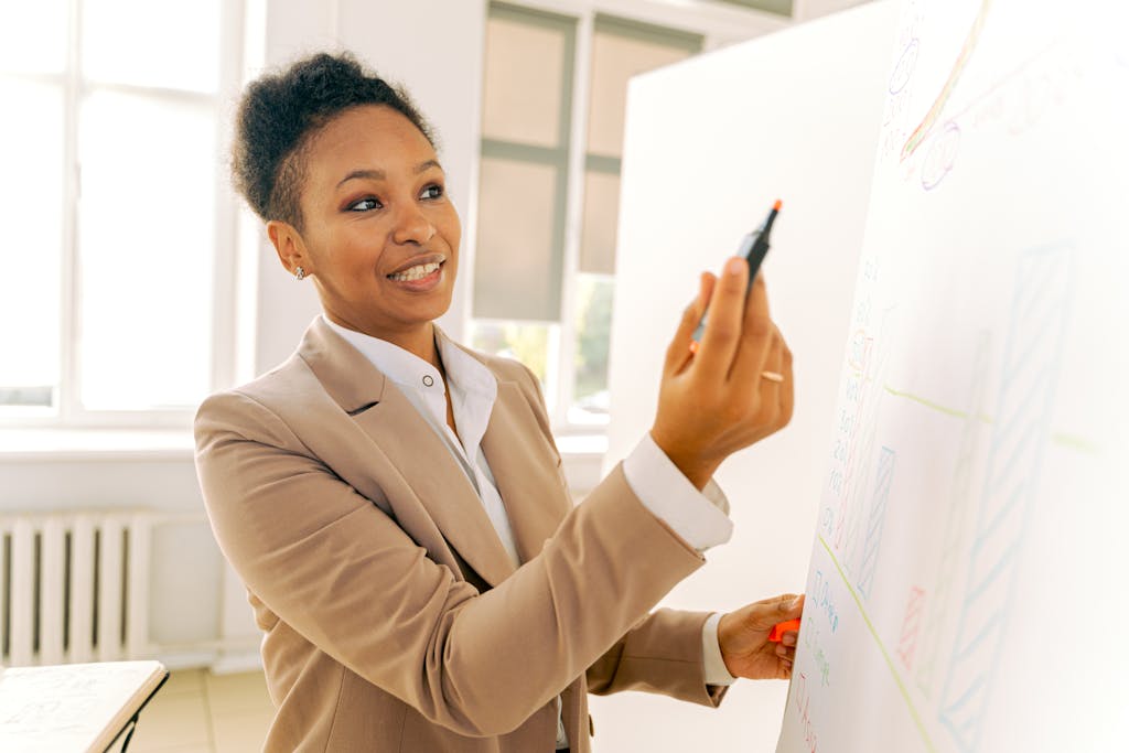 A Woman in Beige Blazer Holding a Pen